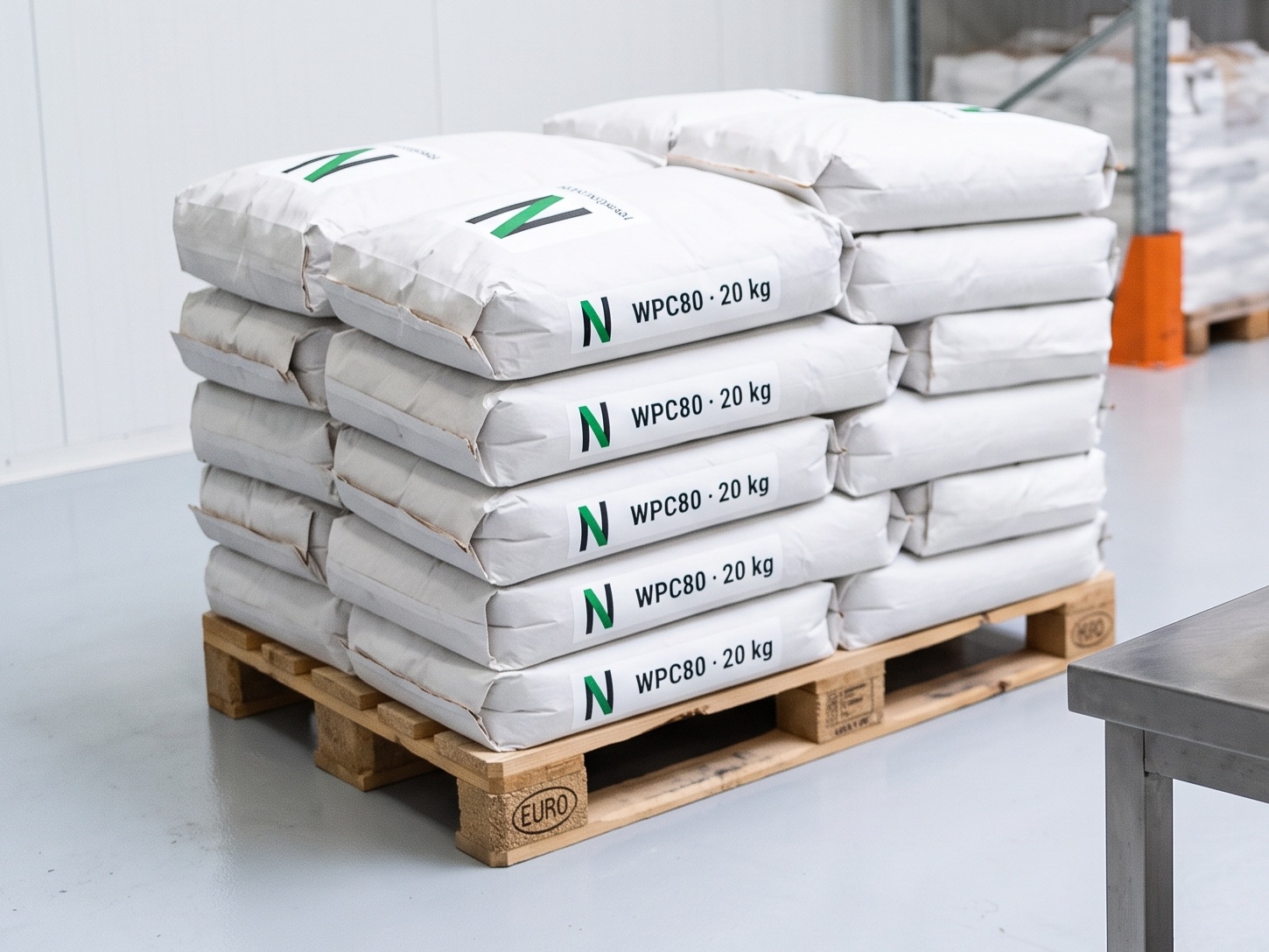 Pallet of 20 kg whey protein bags in a warehouse
